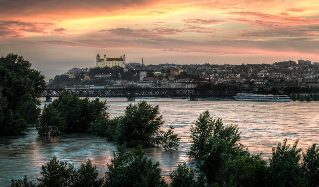 High Water Level on the Danube River with View of Bratislava Castle on Background during Sunset in Bratislava, Slovakia